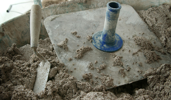 Tools in lime mortar in the process of being made.