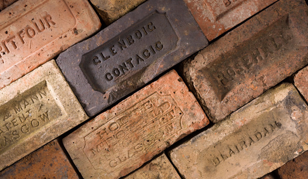 Arrangement of uncemented bricks with different lettering on each