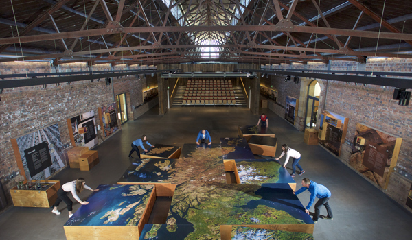 The interior of the Engine Shed with the staff pushing together the large-scale map used as part of their augmented reality activity. 