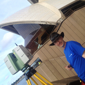 Rob standing outside Sydney Opera house with a laser scanner