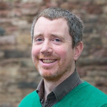 A portrait photo of James Hepher smiling