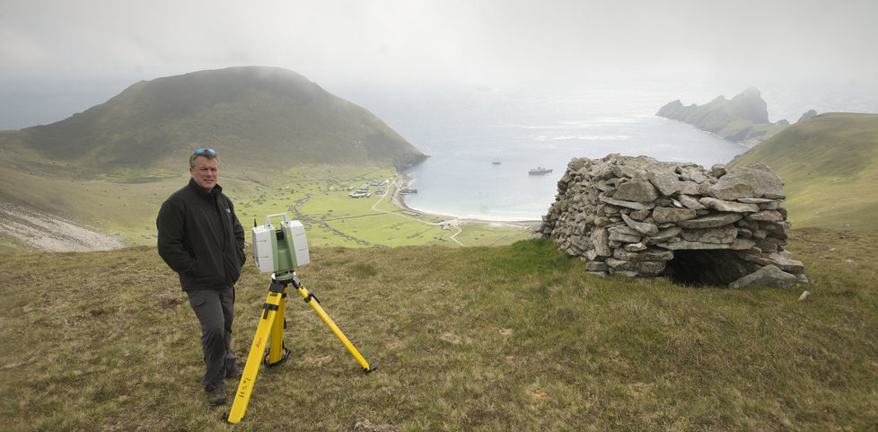 A person laser scanning historic structures in St Kilda