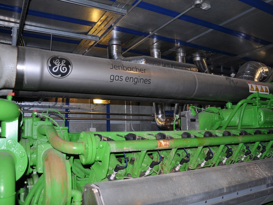 A large piece of machinery and very wide pipes